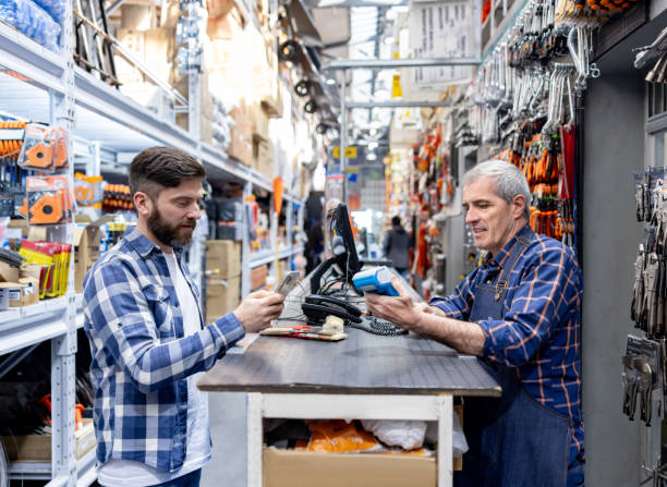istock Customer paying at the cash register at a heardware store 1840466887