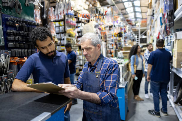 istock Business manager training an employee at a hardware store 1840467391