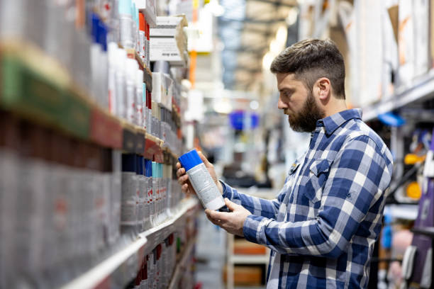 istock Man buying a paint can at a hardware store 1840467923