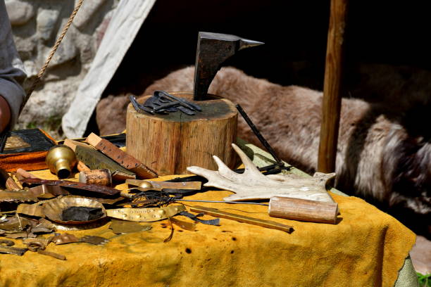 istock A close up on a set of equipment, tools, and ingredients used by a blacksmith, woodworker, archer, or cloth maker seen on a table located next to a tent on a sunny summer day 1840468454