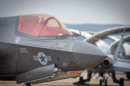 Miramar, California, USA - September 22, 2023: An aviator sits in the cockpit of an F-35 Lightning II, while it rains, at America's Airshow 2023.