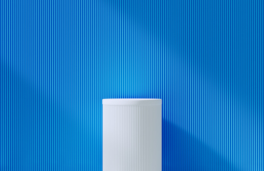 White podium before blue background, Horizontal composition with copy space.