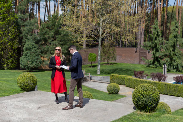 istock Real estate agent and customer inspect cottage residence 1840489634
