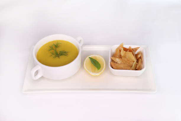 ARABIAN LENTIL SOUP with lemon and crackers served in dish isolated on background side view of arab food