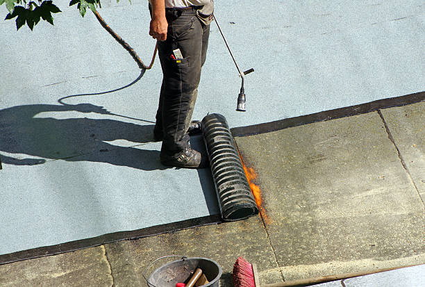 istock A male roofer at work on top of the roof 184049667