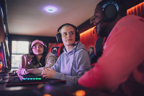 istock Young Woman Discussing Strategy For The Video Game 1840505808