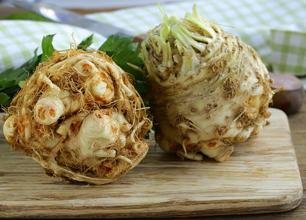istock fresh organic celery root with green leaves 184051199