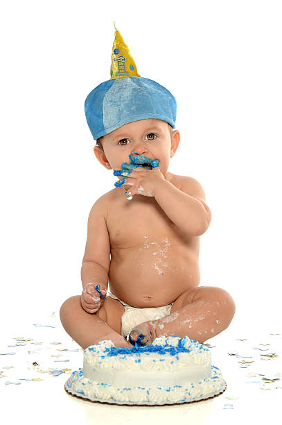 istock One Year Old Boy With Birthday Cake 184051309