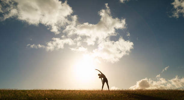 istock Woman doing stretches outdoors at sunset. 1840515827