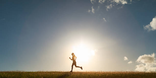 istock Woman running at sunset. 1840515830