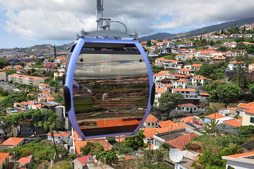 The Funchal cable car is a gondola lift that transports people from Funchal Madeira to the suburb of Monte, Portugal