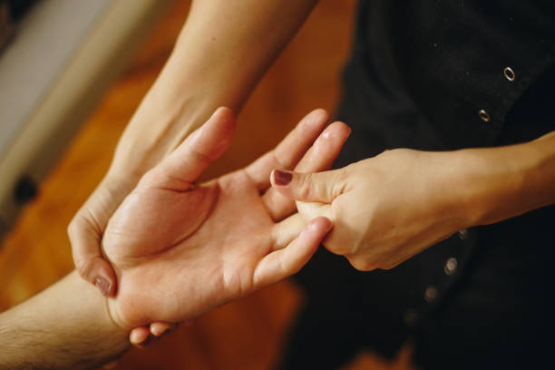 Hand massage close-up stock photo