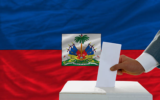 istock man voting on elections in haiti front of flag 184054145