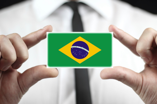 Businessman holding a business card with a Brazil Flag