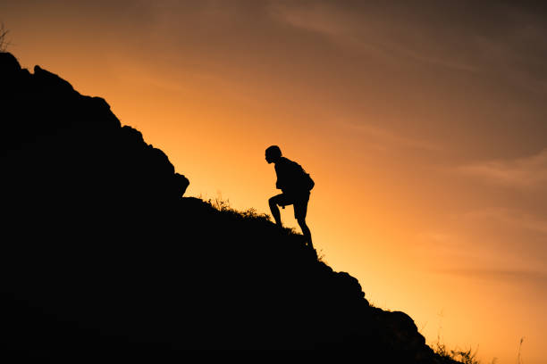 istock Man hiking up the mountain. 1840550723