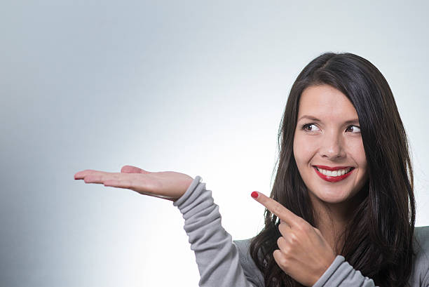 istock Beautiful woman with an empty palm 184055255