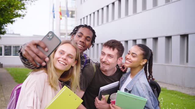 Multiethnic students smiling while taking a selfie in the university
