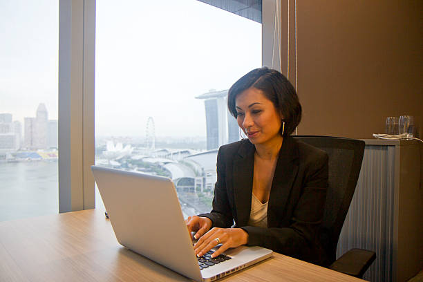 istock Attractive Eurasian businesswoman at work 184056692