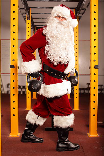 istock Santa Claus preparing for Christmas in gym - kettlebells training 184057067
