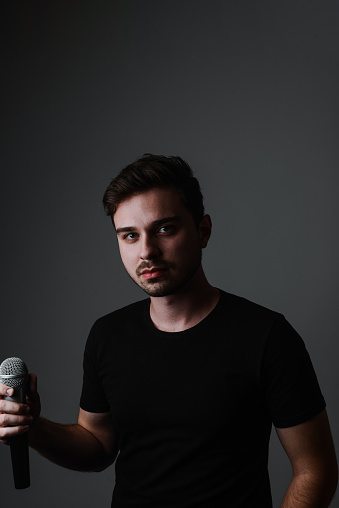 Portrait Of Male Singer Getting Ready To Perform Song