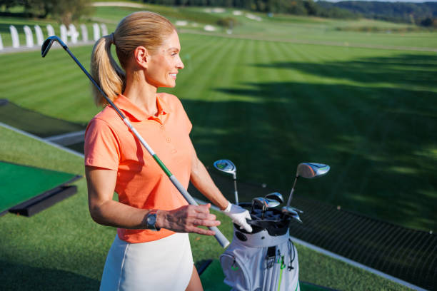 istock Golfing Radiance: Woman in Motion 1840590688