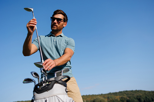 Golf Enthusiast Prepares for the Perfect Swing