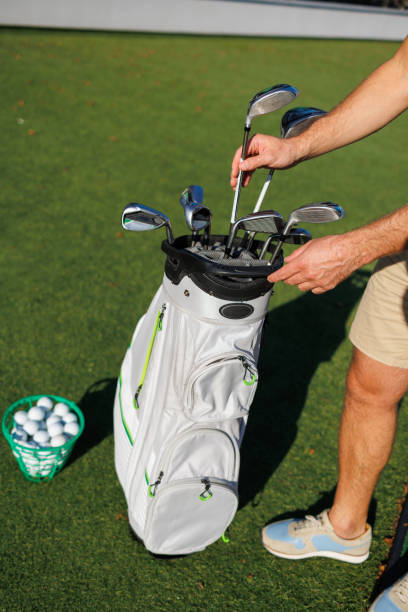 istock Golf Enthusiast Unveils Club on Green 1840599727