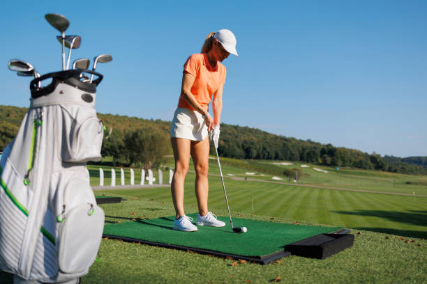 istock Energetic Swing: A Young Golfer Tees Off with Style 1840601330