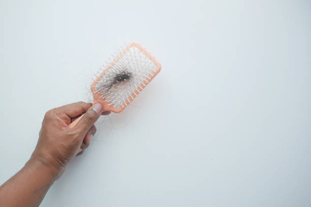 istock man hold his list hair close up 1840607808