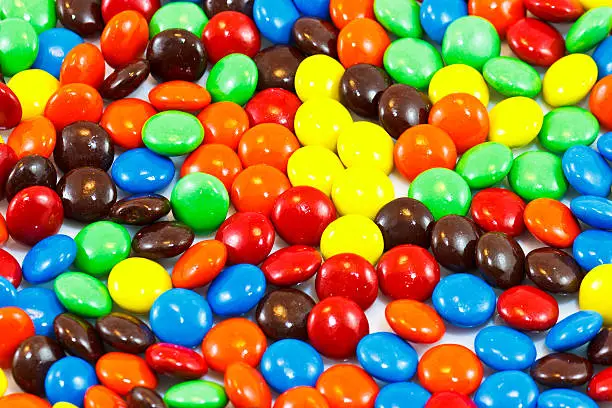 A pile of colorful chocolate coated candy