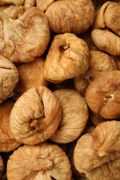 istock Many tasty dried figs as background, top view 1840618012