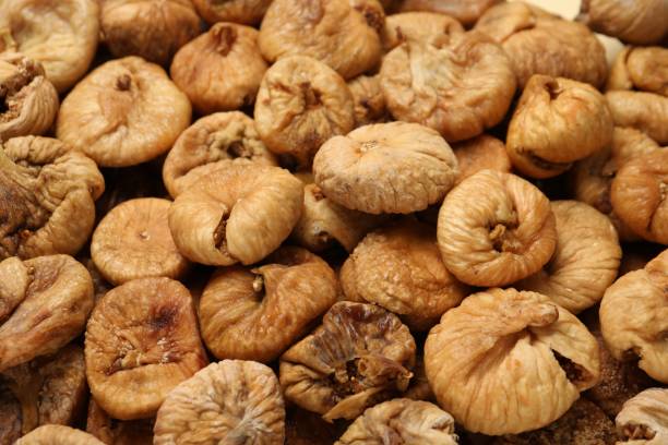 istock Many tasty dried figs as background, closeup 1840620281