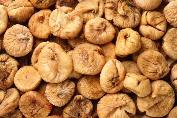 istock Many tasty dried figs as background, top view 1840620807