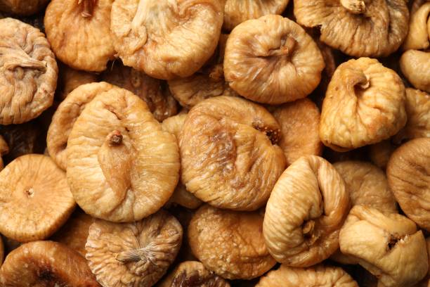 istock Many tasty dried figs as background, top view 1840620812