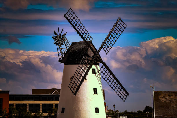 Historic Blennerville windmill in Irish countryside visible from water