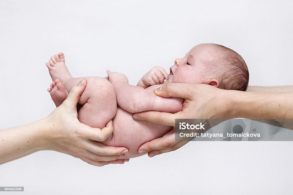 Baby in parents hands Baby - Human Age Stock Photo