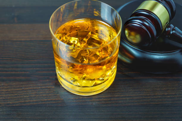 istock Judge gavel and whisky, alcohol and crimes concept 1840626028