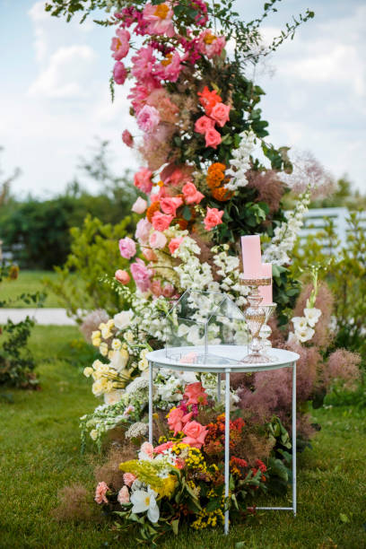 istock Table with glass box on wedding zone decorated with flowers 1840634514