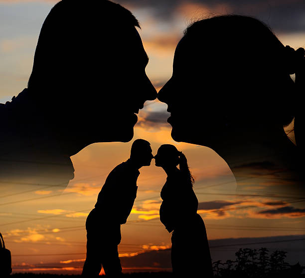 istock silhouette of a young family, 184064239