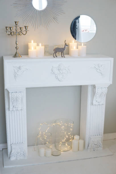istock Bright interior with a false fireplace decorated for Christmas. 1840646919