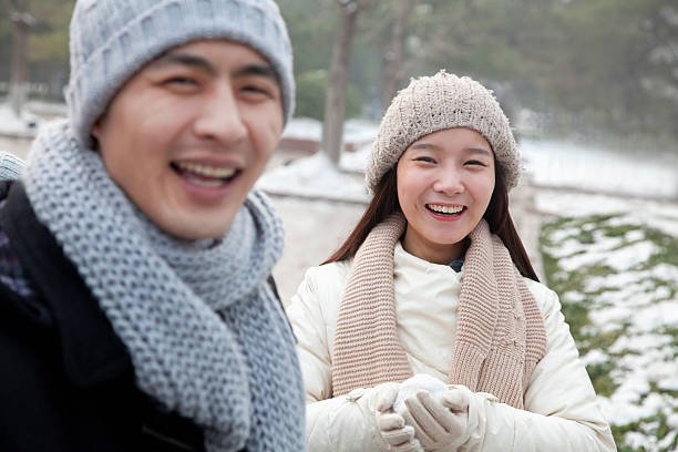 istock Couple Playing in the Snow 184067047