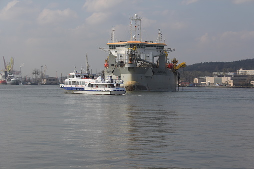 Seaport in Gdynia, Poland. A dredger working in the port of Gdynia to deepen the waterway.