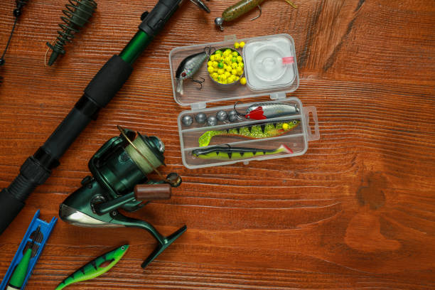istock Fishing tackle on wooden table, flat lay. Space for text 1840679241
