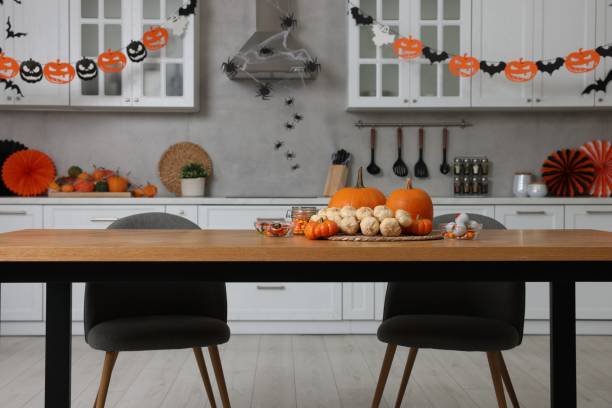 istock Stylish kitchen interior with festive decor. Halloween celebration 1840692366