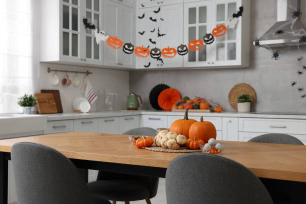 istock Stylish kitchen interior with festive decor. Halloween celebration 1840695904