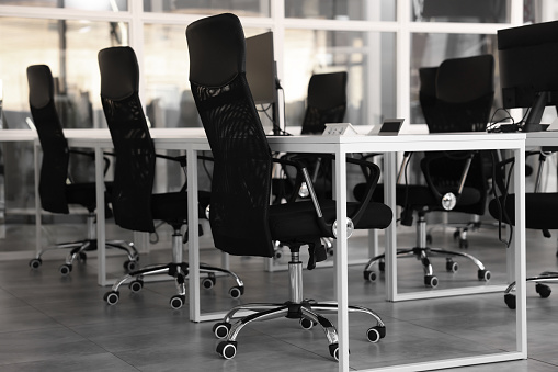 Comfortable office chairs and tables in meeting room