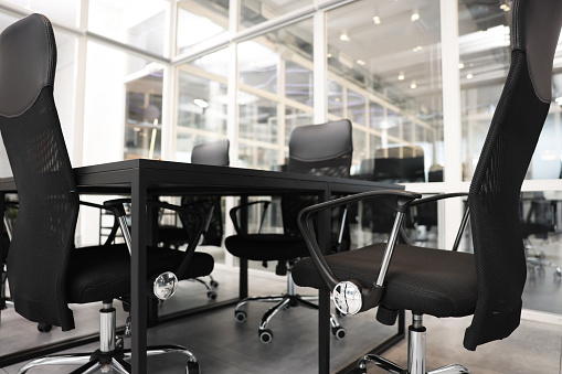 Comfortable office chairs and tables in meeting room