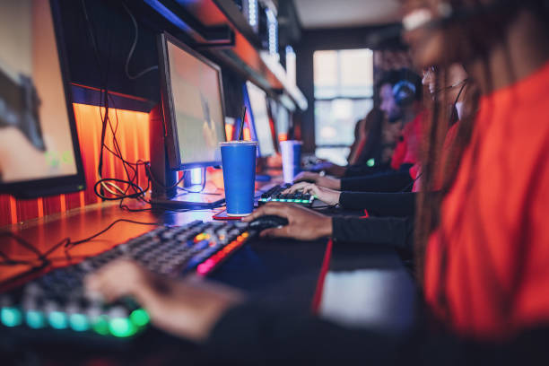 istock Professional eSports Team Playing With Refreshing Drink Next To Them 1840710524