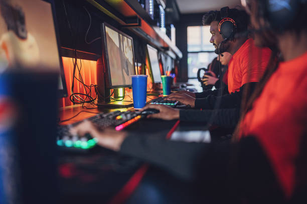istock Professional eSports Team Playing With Refreshing Drink Next To Them 1840715204