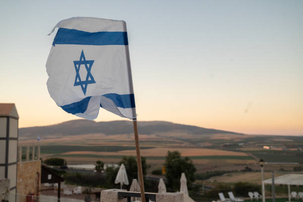 istock Israeli flag in the sunset 1840736852